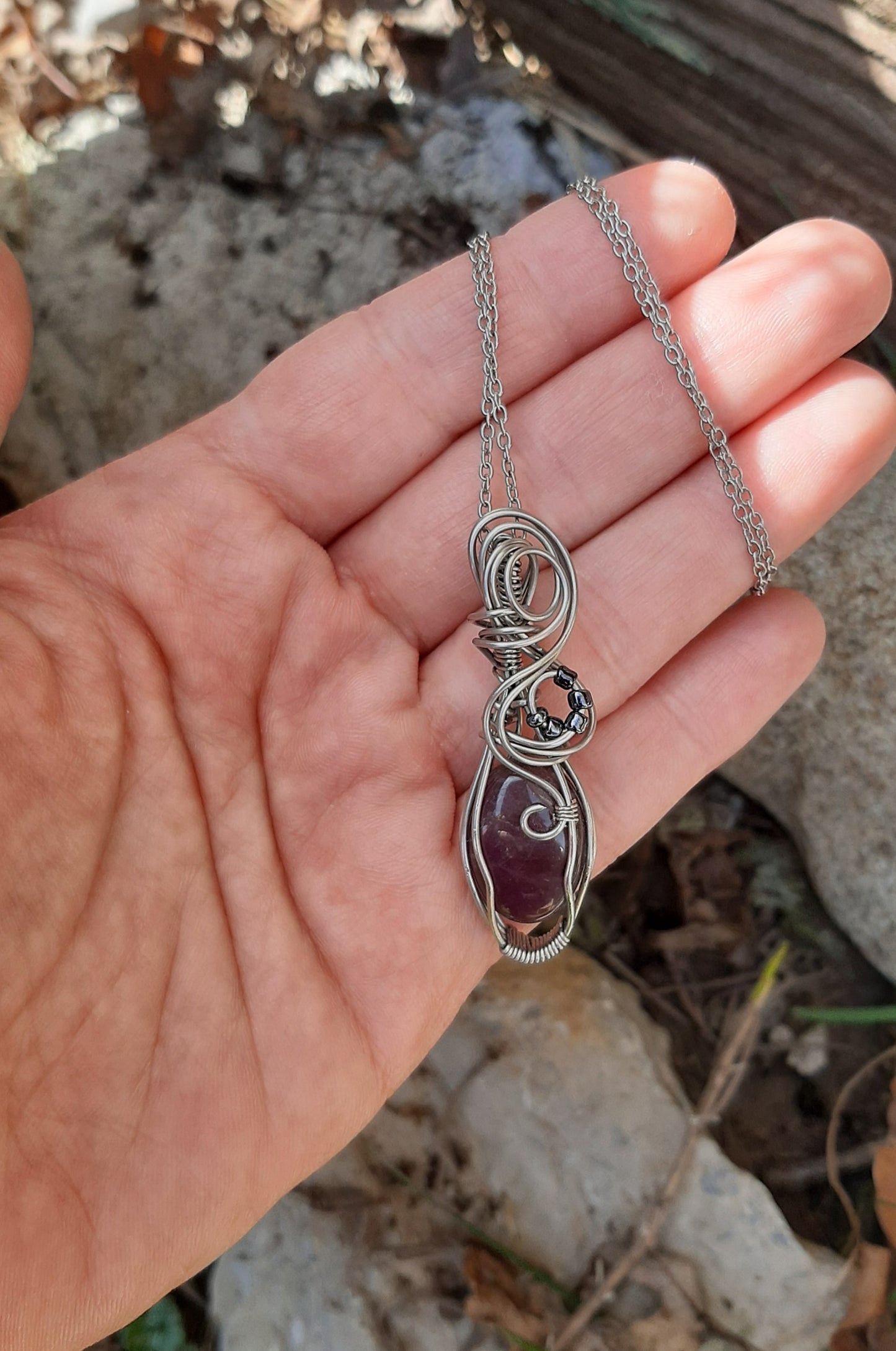 Amethyst wrapped in Stainless steel