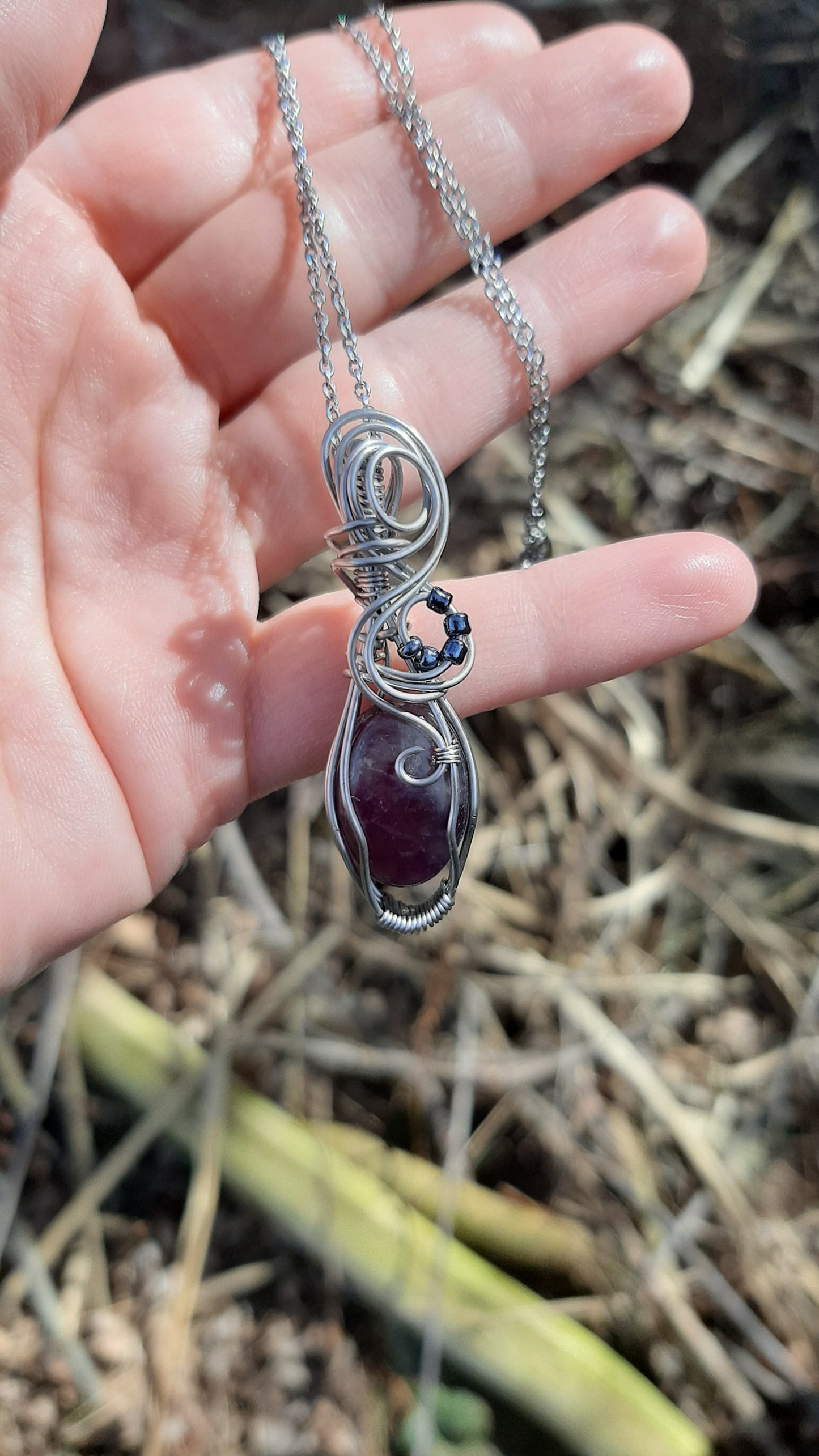 Amethyst wrapped in Stainless steel