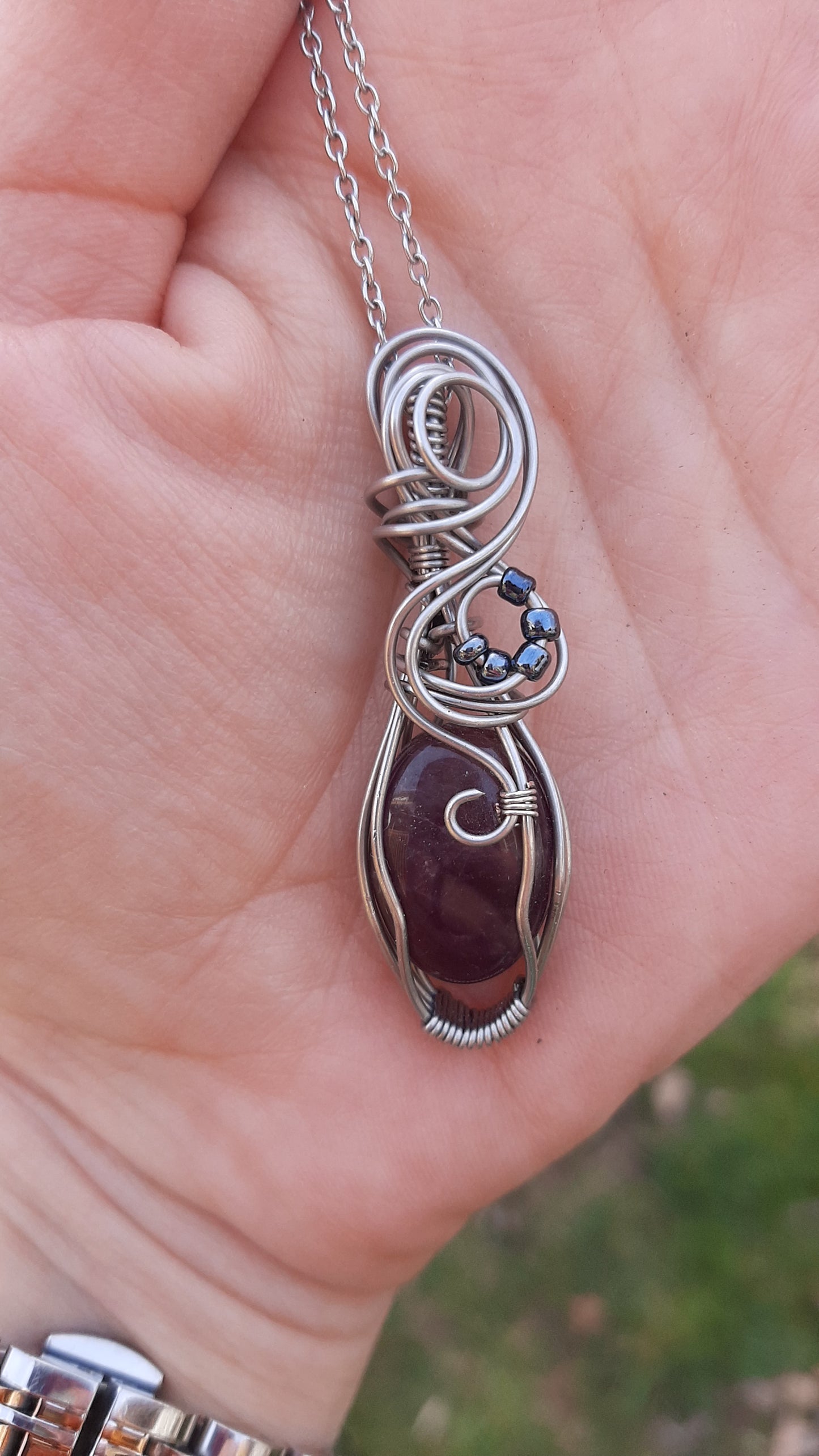 Amethyst wrapped in Stainless steel