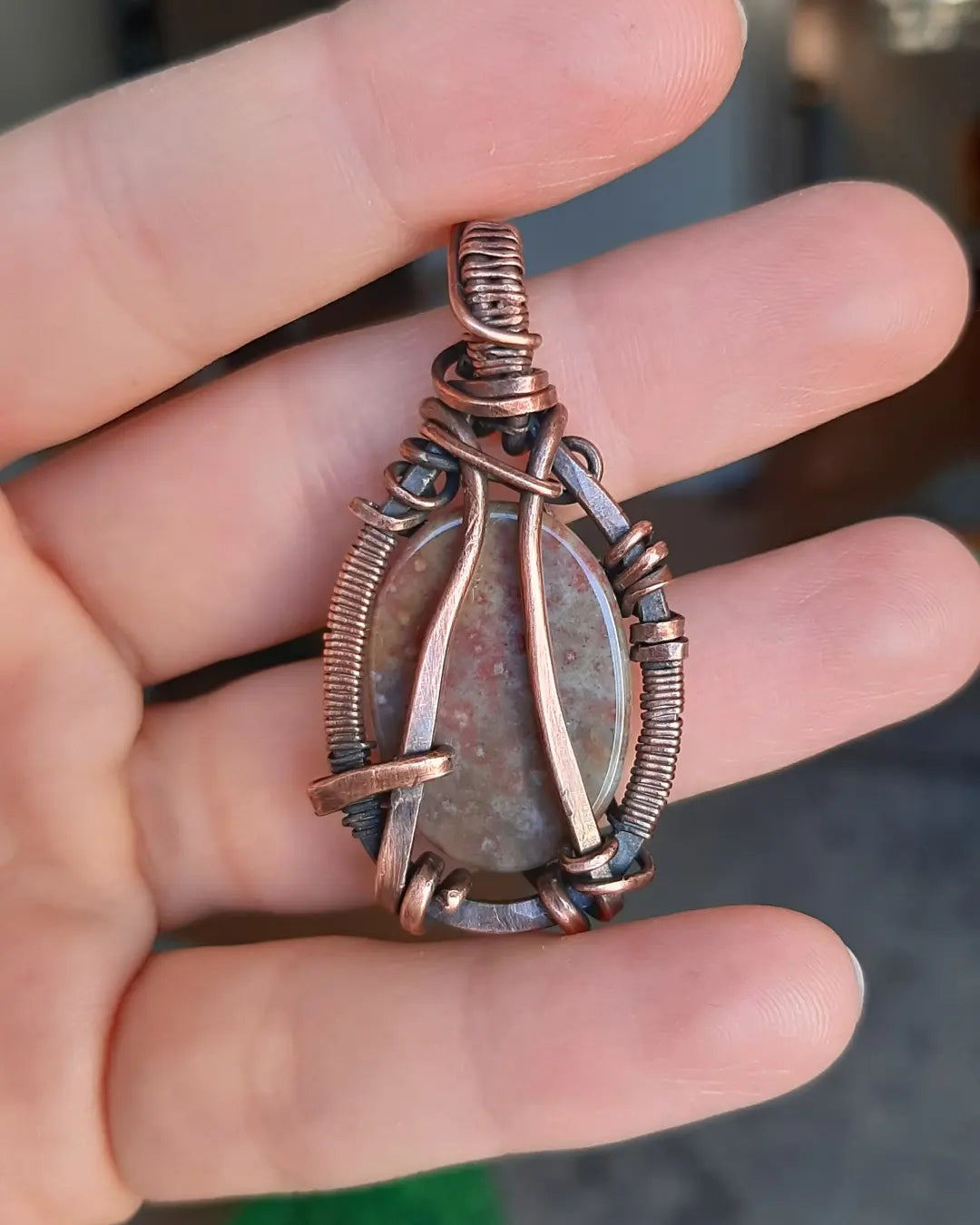 Indian Agate wrapped in oxidized copper