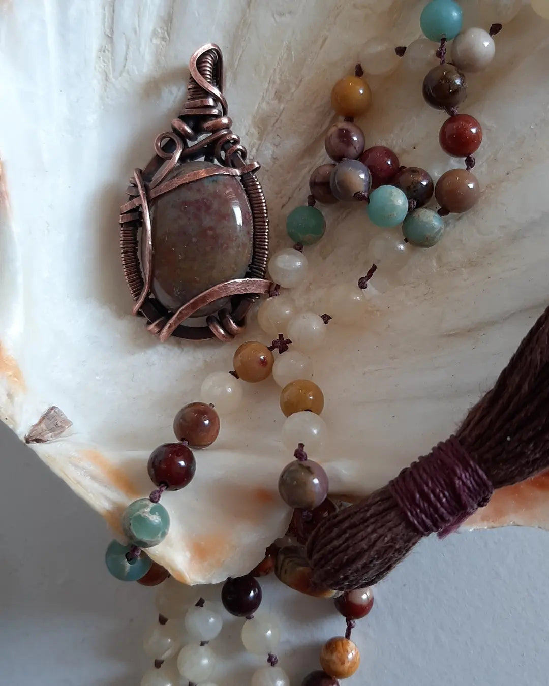 Indian Agate wrapped in oxidized copper