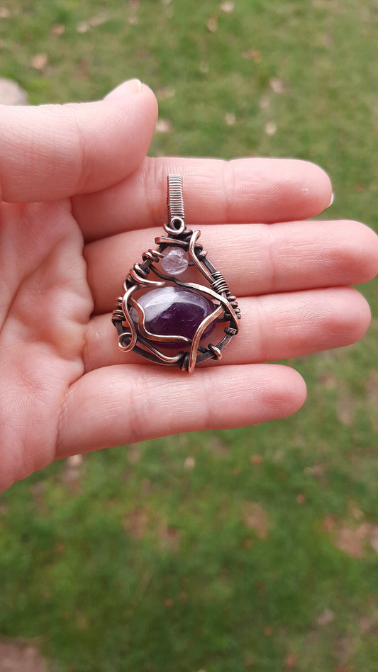 Amethyst wrapped in copper metal